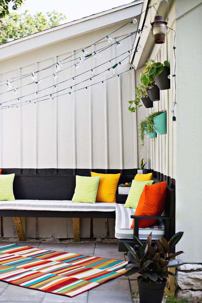 Wall of Pots and Curtain of Lights #diy #porch #patio #projects #colorful #decorhomeideas