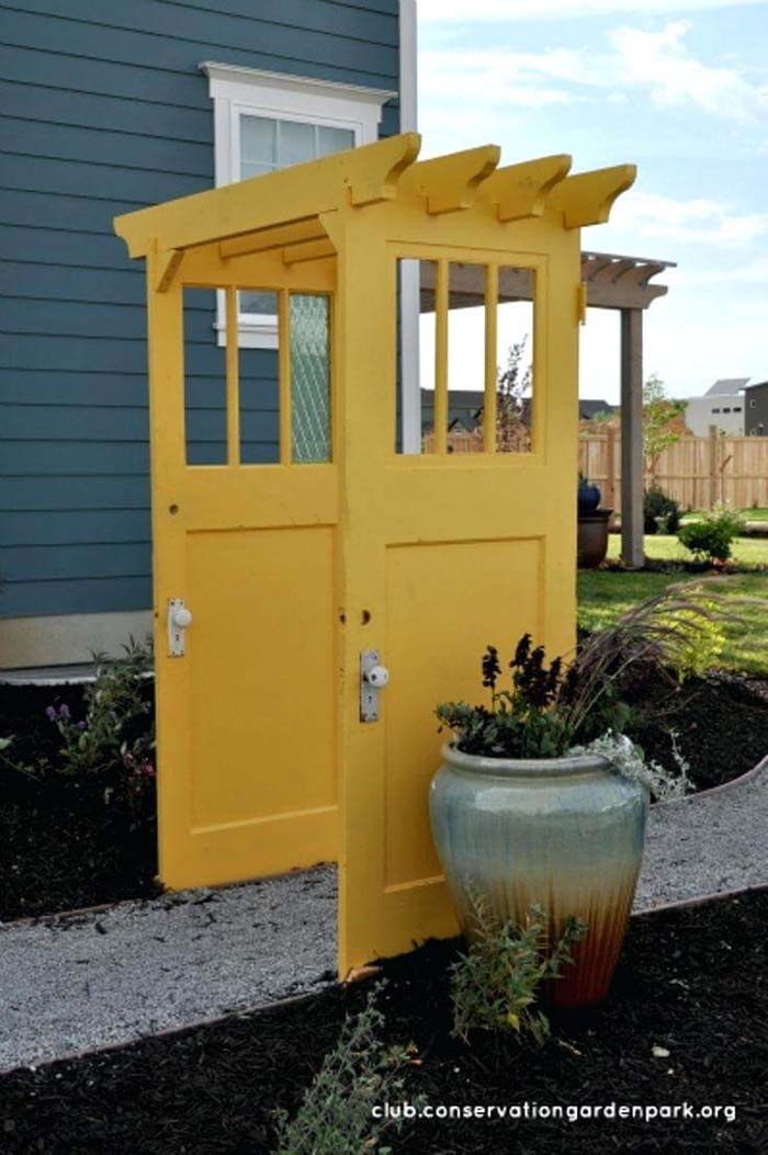 Brightly Painted Doors Make a Pergola #olddooroutdoordecor #olddoorgarden #decorhomeideas