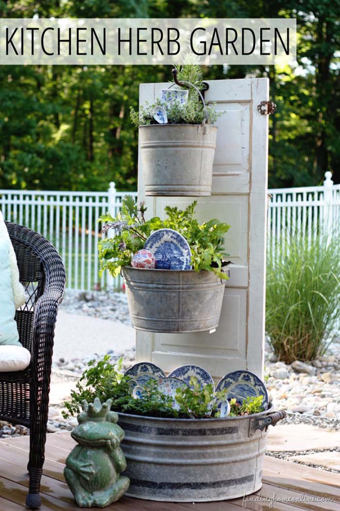 Kitchen Herb Garden with an Old Door #olddooroutdoordecor #olddoorgarden #decorhomeideas