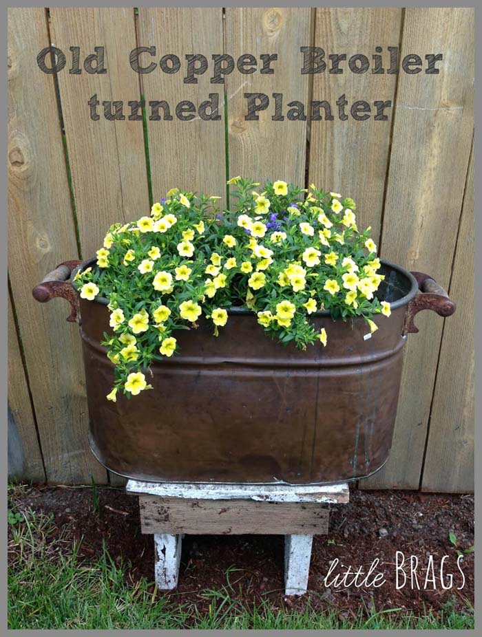 Vintage Boiler with Blooming Petunias #repurposedplanter #repurposedcontainer #decorhomeideas