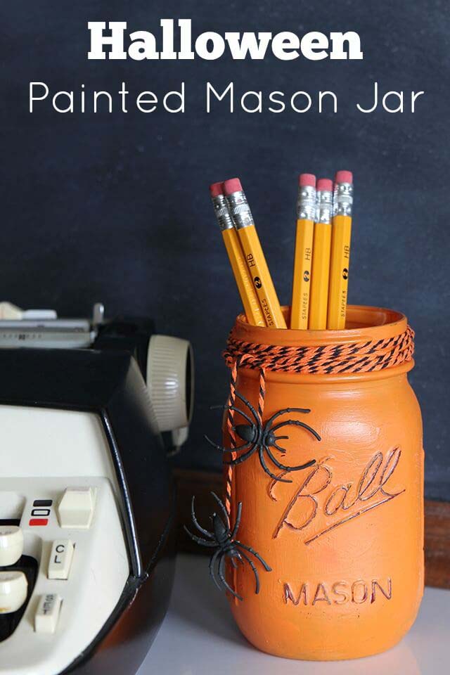 46. Sweet Painted Halloween Mason Jar Storage #halloween #masonjar #crafts #decorhomeideas