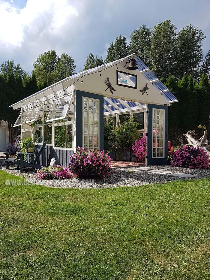 So many asked about how we built it so this is what we did. All items except for the floor and roof was made from recycled materials, it is 12x14 and it costs us approximately $3000.00 to build Canadian. We live in northern British Columbia, Canada we don't heat it in the winter so no plants stay in there